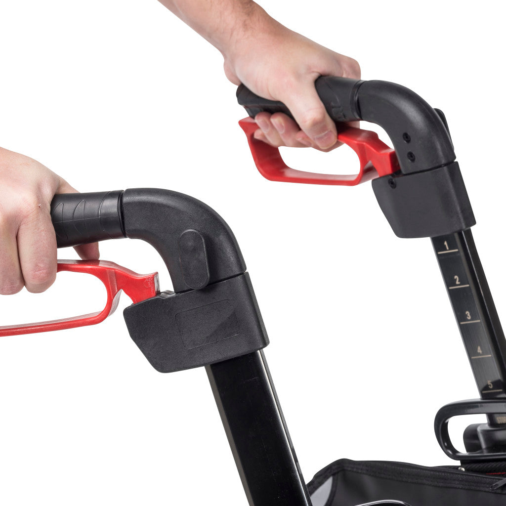 Hands on the Nitro rollator handle grips showing the height-adjustable handle